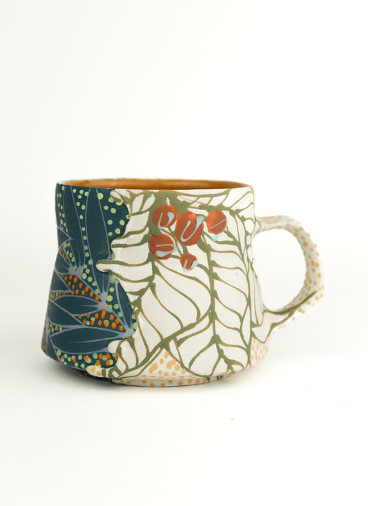 White and teal split mug
